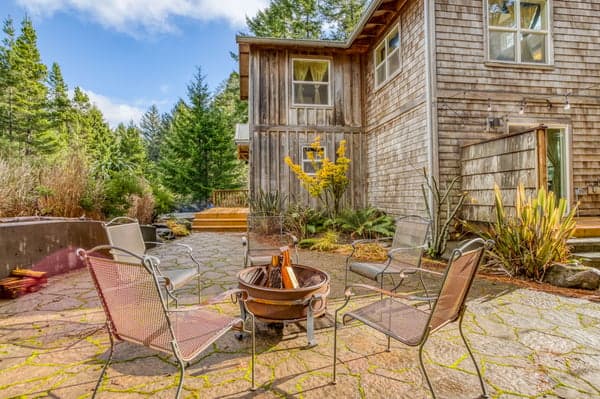 Outdoor yard seating with a wood pit